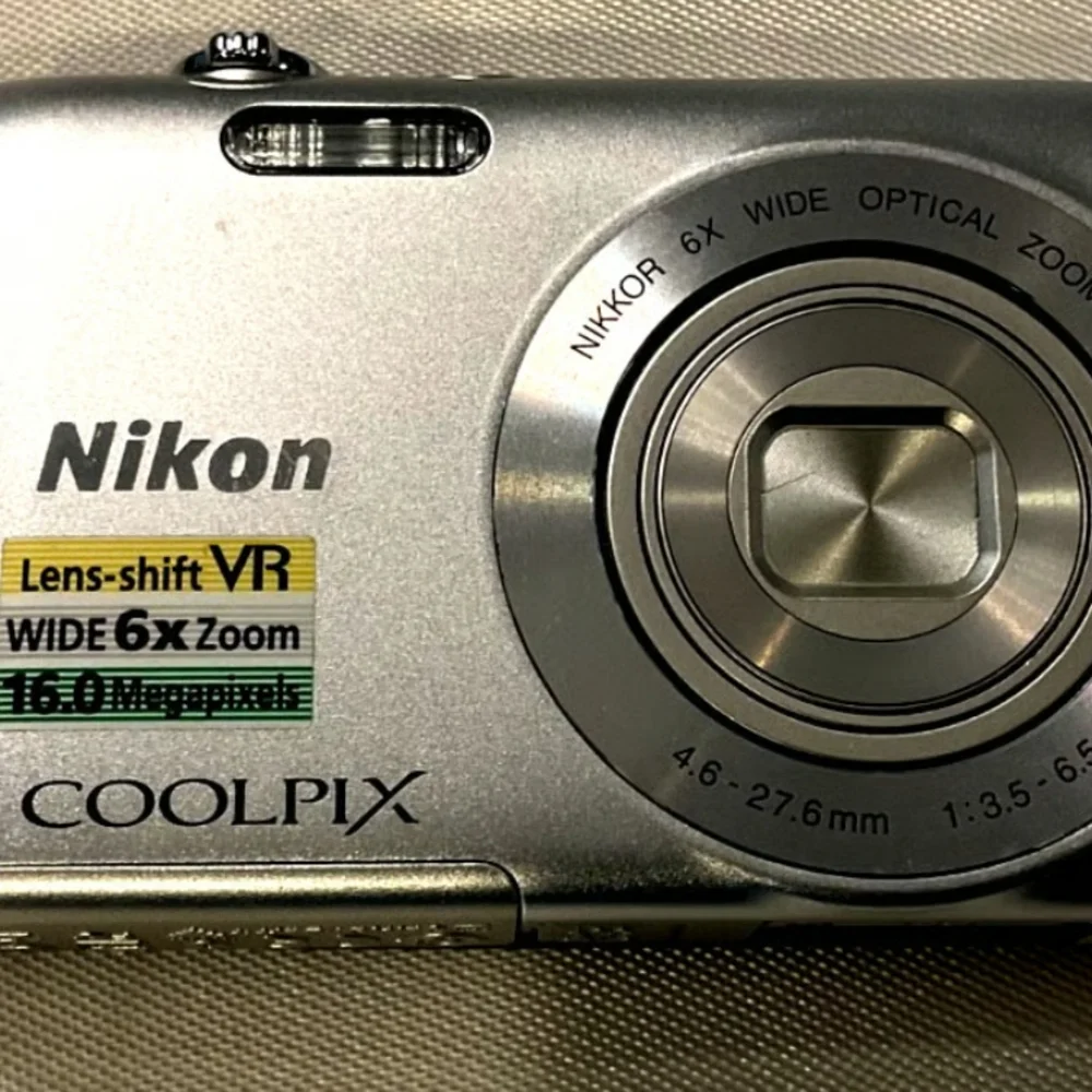 Nikon Coolpix Silver Camera with Accessories